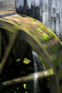 TN, Cades Cove Grist mill water wheel in motion
