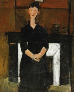 Woman Sat By a Fireplace