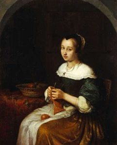 A Woman Knitting With a Basket of Fruit