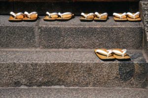 Japan, Kyoto Zori sandals on steps of a shrine