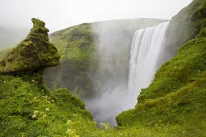 Iceland Waterfall plunges over a volcanic cliff