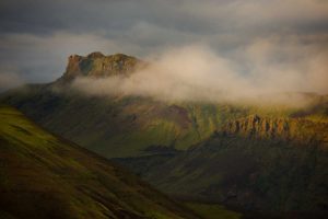 Iceland Low cloudsover mountain ridges at sunset