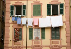 Italy, Camogli Laundry hangs across a building