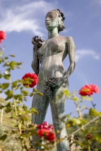 Italy, Manarola Statue of woman holding grapes