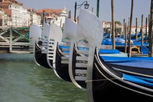 Italy, Venice Prows of a row of gondolas