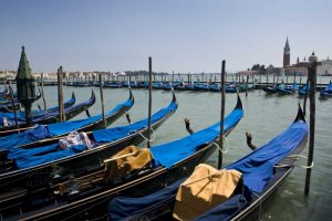 Italy, Venice A row of gondolas docked