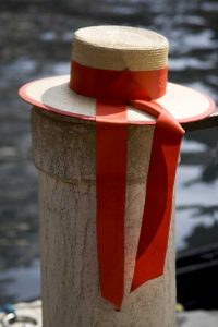 Italy, Venice Colorful gondoliers hat on piling