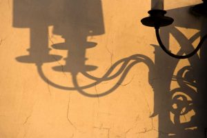 Italy, Venice Lamp and shadows on a yellow wall