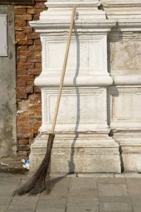Italy, Venice Handmade broom against a pillar
