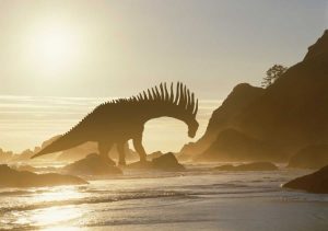 Concept of Amargasaurus dinosaur on ocean shore