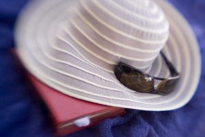 French Polynesia Sun hat, sunglasses and book
