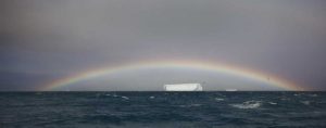 Antarctica, A tabular iceberg under a low rainbow